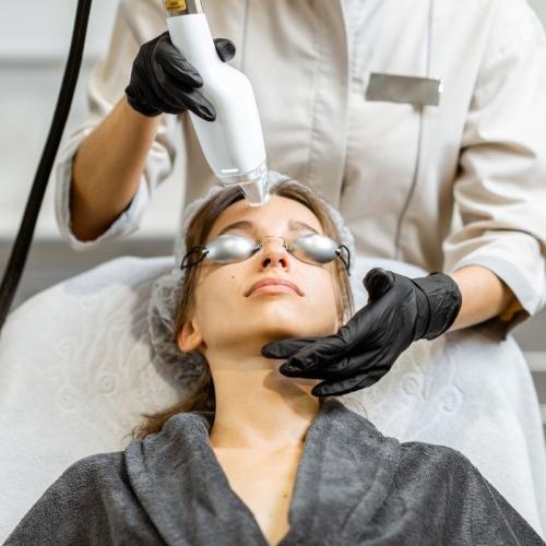 A woman receiving a laser treatment