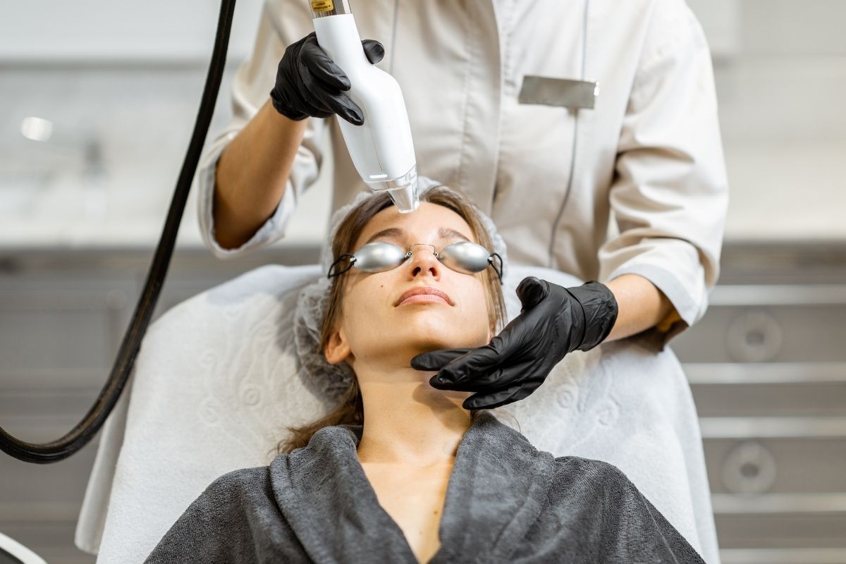 A woman receiving a laser treatment